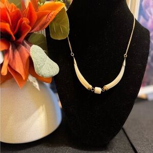 Vintage mother of pearl horn shaped necklace with gold tone end caps and chain